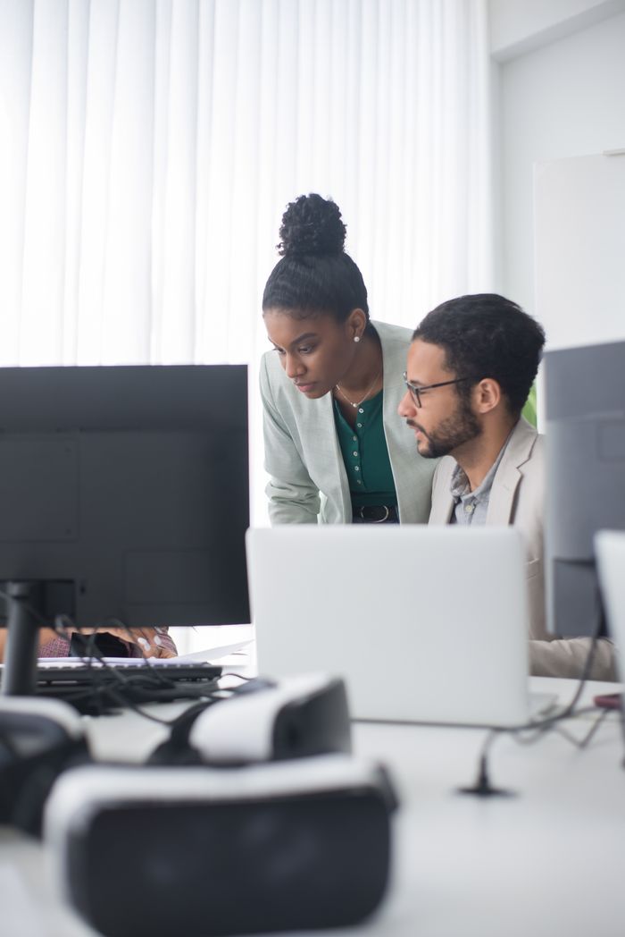 Mastering the First Impression: Your intriguing post title goes here Two professionals collaborate in a modern office setting, promoting teamwork and innovation.